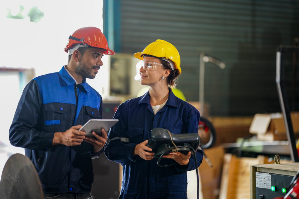 Two people using Augmented Reality for Industry 4.0 in an industrial setting.