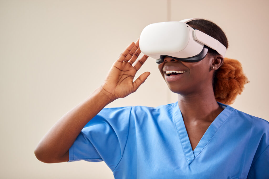 Female nurse or doctor in scrubs with VR headset.